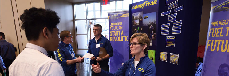 College of Business student in discussion with a Goodyear female representative at the 2020 career fair