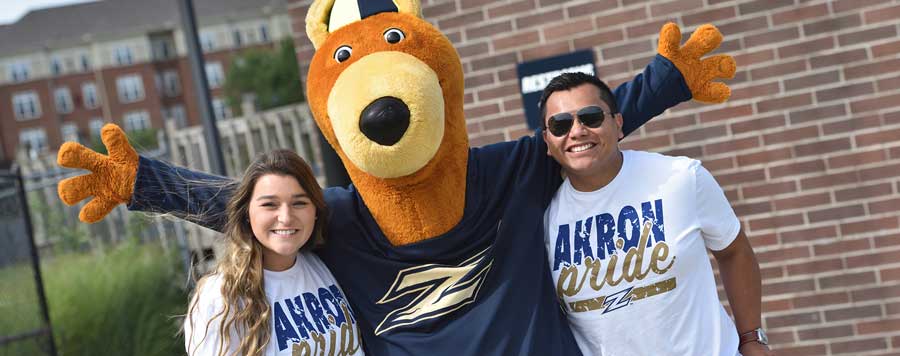 students on UA campus with the mascot Zippy