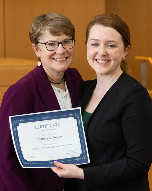 Clinical Professor Joann Sahl congratulates Courtney Middleton on the Outstanding Clinical Student Award.