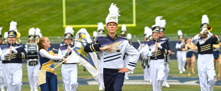 The University of Akron Marching Band performs at a football game