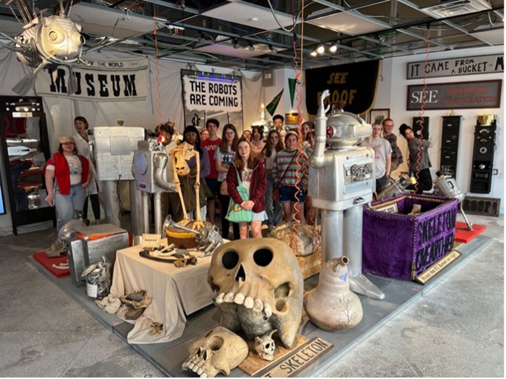 A group of young people pose in a pop-up store