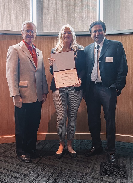 Rachael Gilmore, University of Akron International Business major receiving her completion certificate during the graduation ceremony for the Spring/ Summer 2022 cohort