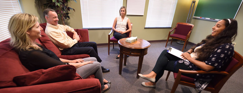 A couple meeting with a counselor at the Center for Individual and Family Counseling at The University of Akron