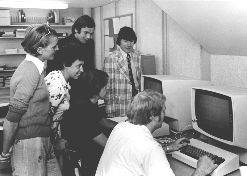 Students gather around computers in the Computer Center in 1974 at The University of Akron