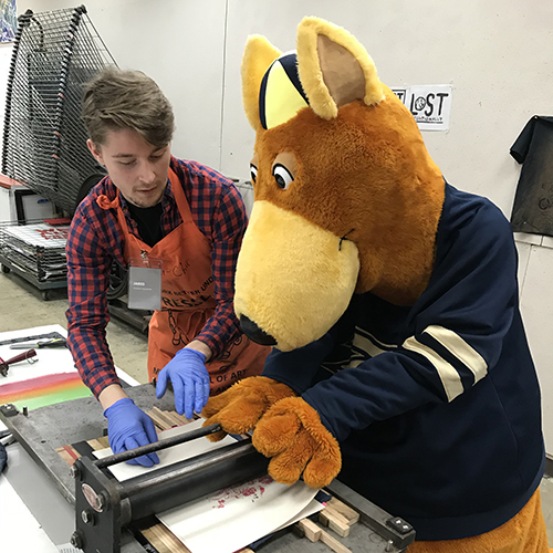 Zippy learns about printmaking at Portfolio Day and Open House