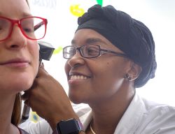 UA nurse performs an ear exam