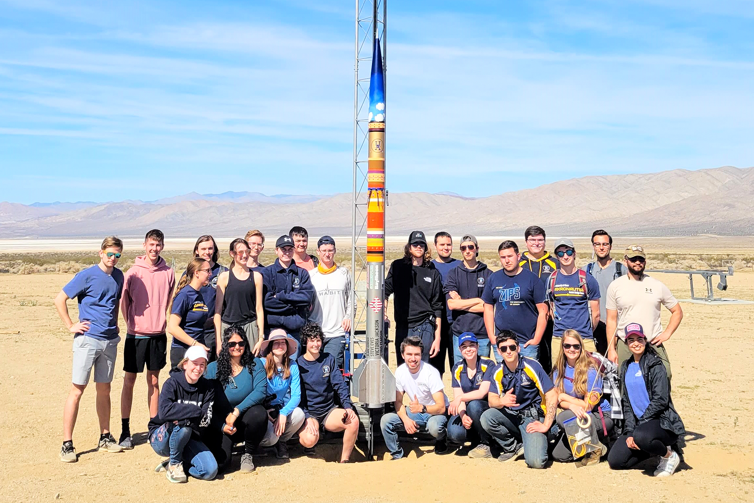 Akronauts team members in the Mojave Desert with their Emergence II rocket.