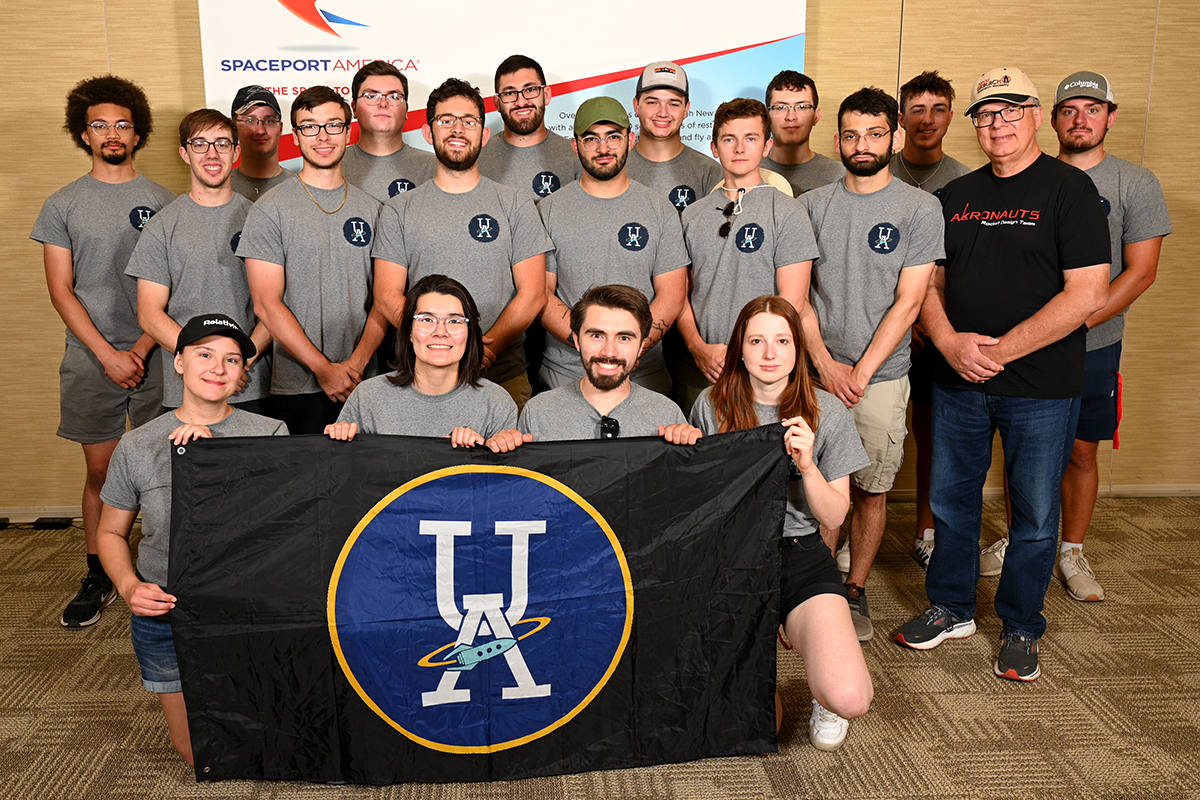 The Akronauts, along with their mentor, Chris Pearson, at the Spaceport America Cup registration.