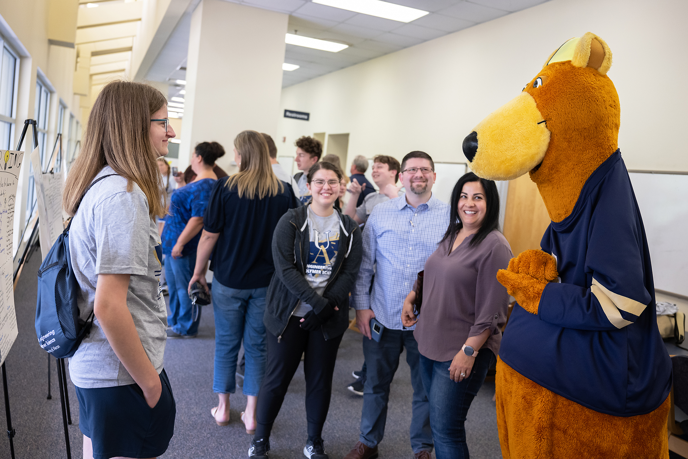Zippy takes a look at the student poster presentations and interacts with students and parents at the awards banquet.