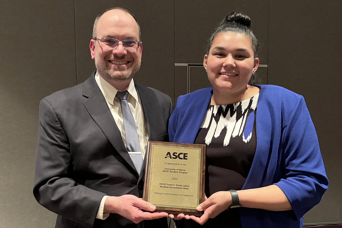 Dr. David Roke and Meganne Chapman receiving a plaque from ASCE in appreciation for hosting this year's symposium.