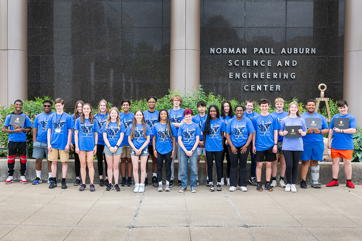 Summer Experience in Engineering campers pose in front of the Auburn Science and Engineering Center.