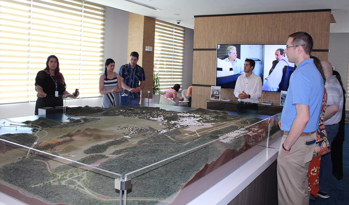 MBA students with diorama of Panama Pacifico