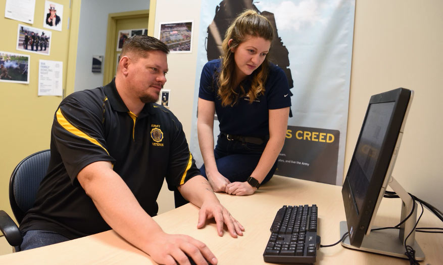 A veteran receives assistance at UA's Military Services Center
