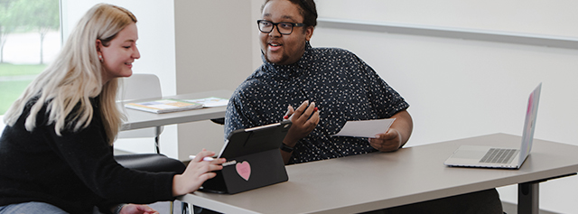 A student tutoring another student